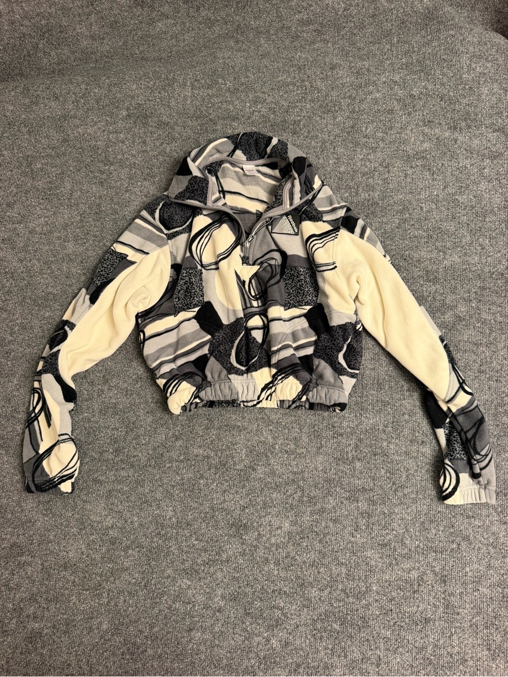 Reebok Abstract Crop Bomber Jacket in Cream and Black